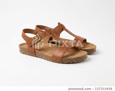Comfortable Brown Leather Sandals with Cork Soles, Stylish Summer Footwear for Women, Isolated on White 137333456