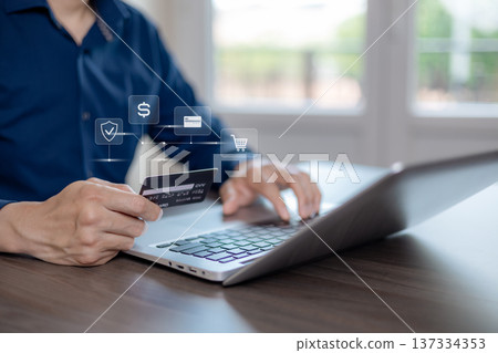 Online Payment and Secure E-Commerce Transaction with Credit Card on Laptop 137334353