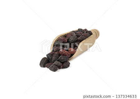 Dogwood or Cornel fruit herb used in herbal medicine in wooden scoop isolated on white background. Medicinal herb. Dogwood or Cornel fruit herb used in herbal medicine in wooden scoop isolated on white background. Medicinal herb. 137334633