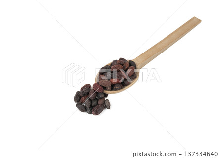 Dogwood or Cornel fruit herb used in herbal medicine on wooden spoon isolated on white background. Herbs. Alternative medicine. Dogwood or Cornel fruit herb used in herbal medicine on wooden spoon isolated on white background. Herbs. Alternative medicine. 137334640