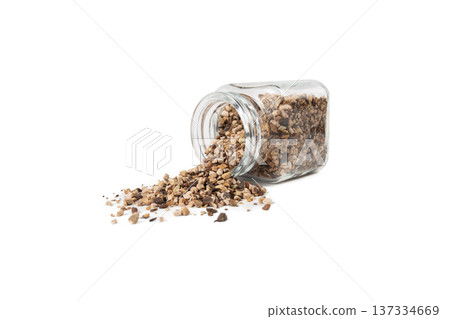 Bistorta officinalis known as bistort, common bistort, European bistort or meadow bistort falling from glass jar isolated on white background. Bistorta officinalis known as bistort, common bistort, European bistort or meadow bistort falling from glass jar isolated on white background. 137334669