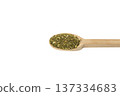passion flower herb in latin - passiflora incarnata on wooden spoon isolated on white background.  Herbs. Alternative medicine. 137334683