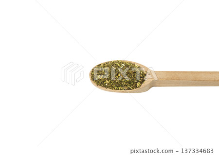 passion flower herb in latin - passiflora incarnata on wooden spoon isolated on white background.  Herbs. Alternative medicine. 137334683