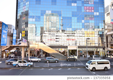 The JR Kinshicho Station building and Skytree reflected in the glass wall of the building The JR Kinshicho Station building and Skytree reflected in the glass wall of the building 137335058