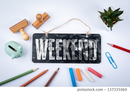 Weekend Concept With Chalkboard Sign WEEKEND on Creative Workspace Flat Lay Weekend Concept With Chalkboard Sign WEEKEND on Creative Workspace Flat Lay 137335069