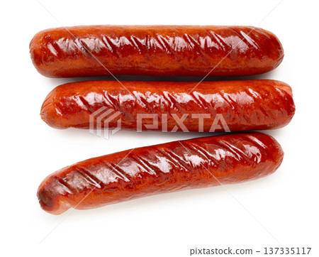 Appetizing fried sausages close-up on a white isolated background Appetizing fried sausages close-up on a white isolated background 137335117