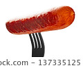 Appetizing sausage on a fork, isolated on white background 137335125