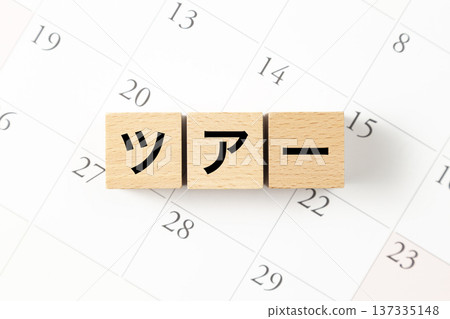 A block with the word "Tour" written on it and a calendar 137335148