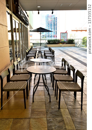 A stylish cafe with outdoor tables in front of Ebina Station on the Odakyu Line A stylish cafe with outdoor tables in front of Ebina Station on the Odakyu Line 137335152