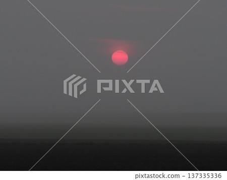 The red sun sunrise. Dramatic Dawn in the field. Stunning Scenic meadow Landscape. Mystical Background. The red sun sunrise. Dramatic Dawn in the field. Stunning Scenic meadow Landscape. Mystical Background. 137335336