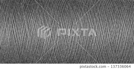macro texture of a skein of grey sewing thread 137336064