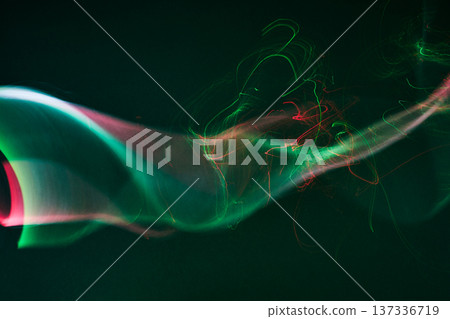 Abstract glowing light trails creating dynamic wavy lines Abstract glowing light trails creating dynamic wavy lines 137336719