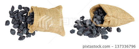 black raisins in bag isolated on white background. Top view. Flat lay black raisins in bag isolated on white background. Top view. Flat lay 137336796