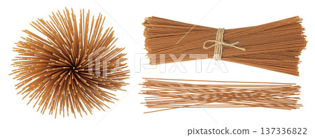 raw wholegrain spaghetti isolated on a white background. Top view. Flat lay raw wholegrain spaghetti isolated on a white background. Top view. Flat lay 137336822