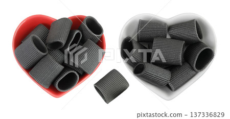 Black pasta with cuttlefish ink in ceramic bowl isolated on white background. Top view. Flat lay Black pasta with cuttlefish ink in ceramic bowl isolated on white background. Top view. Flat lay 137336829
