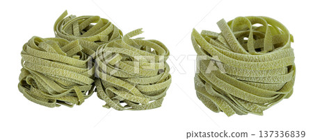 Raw tagliatelle green pasta with spinach isolated on white background Raw tagliatelle green pasta with spinach isolated on white background 137336839