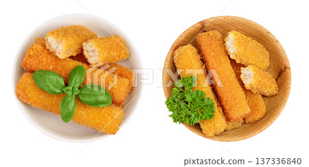 Fish finger or stick with parsley in ceramic and wooden bowl isolated on white background. Top view. Flat lay 137336840