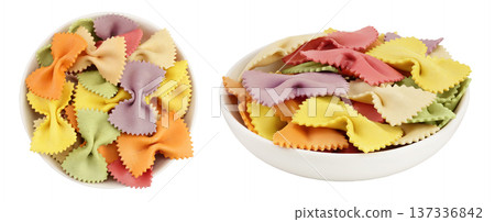 colorful farfalle pasta in ceramic bowl isolated on white background with full depth of field. Top view. Flat lay. 137336842