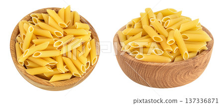 Raw italian penne rigate pasta in wooden bowl isolated on white background with full depth of field. Top view. Flat lay 137336871