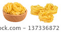 Raw tagliatelle pasta in wooden bowl isolated on white background with full depth of field 137336872