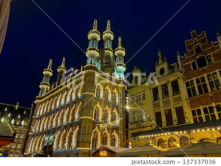 Night view of Leuven town hall decorated for christmas with outdoor market Night view of Leuven town hall decorated for christmas with outdoor market 137337036