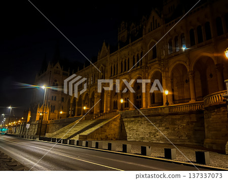 Nighttime photograph of the front facade of the Hungarian Parliament Building 137337073