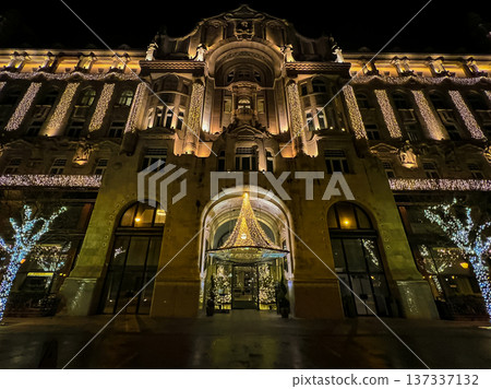 building in Budapest with large windows and chandeliers with ornate architecture building in Budapest with large windows and chandeliers with ornate architecture 137337132