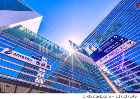 Yokohama cityscape in March, Japan. SOTETSU: The Sotetsu Line, the Bay Sheraton H and high-rise apartment buildings reflected in the glass windows, sunlight... Yokohama cityscape in March, Japan. SOTETSU: The Sotetsu Line, the Bay Sheraton H and high-rise apartment buildings reflected in the glass windows, sunlight... 137337149