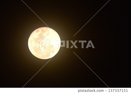 bright yellow full moon floating on sky in night background 137337151