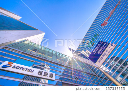 Yokohama cityscape in March, Japan. SOTETSU: The Sotetsu Line, the Bay Sheraton H and high-rise apartment buildings reflected in the glass windows, sunlight... Yokohama cityscape in March, Japan. SOTETSU: The Sotetsu Line, the Bay Sheraton H and high-rise apartment buildings reflected in the glass windows, sunlight... 137337355