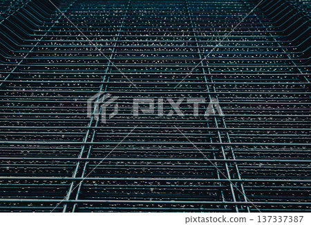 Metal grille with water droplets glistening. Rainy atmosphere, perfect for urban or industrial themes. Suggests freshness, renewal, or quiet moments. Ideal for backgrounds, mood boards, or design Metal grille with water droplets glistening. Rainy atmosphere, perfect for urban or industrial themes. Suggests freshness, renewal, or quiet moments. Ideal for backgrounds, mood boards, or design 137337387