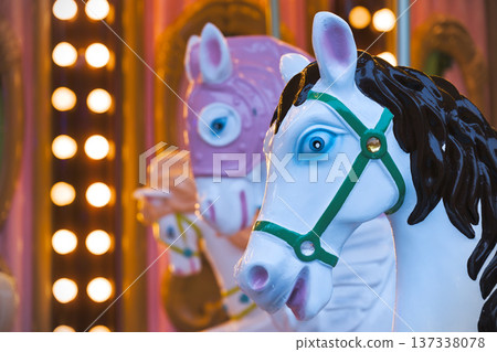 A white carousel horse with a black mane A white carousel horse with a black mane 137338078