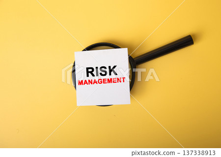 Magnifying glass examining risk management business assessment concept Magnifying glass examining risk management business assessment concept 137338913