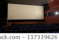 Empty Movie Theater Interior with Blank Cinema Screen and Rows of Seats 137339626