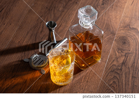 Rusty Nail Cocktail with Lemon Peel in Crystal Glass Rusty Nail Cocktail with Lemon Peel in Crystal Glass 137340151