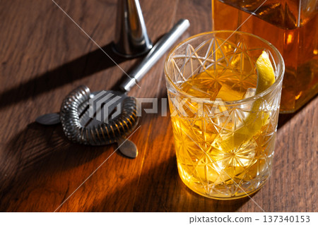 Rusty Nail Cocktail with Lemon Peel in Crystal Glass Rusty Nail Cocktail with Lemon Peel in Crystal Glass 137340153