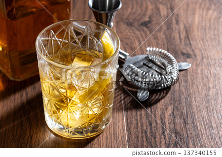 Rusty Nail Cocktail with Lemon Peel in Crystal Glass Rusty Nail Cocktail with Lemon Peel in Crystal Glass 137340155