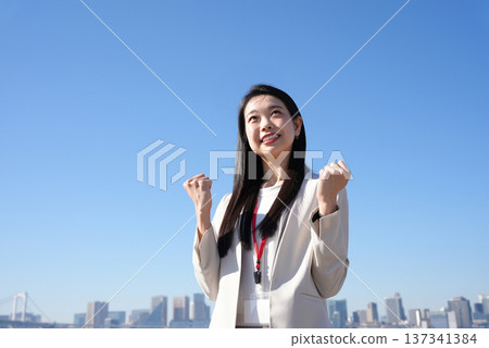 A young businesswoman posing in support A young businesswoman posing in support 137341384
