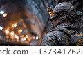 Close-up Profile of Muddy Tunnel Worker with Headlamp Underground 137341762