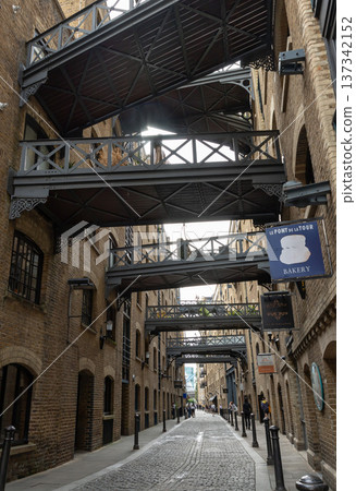 View along the iconic street of Shad Thames and features Victorian-era warehouse architecture. View along the iconic street of Shad Thames and features Victorian-era warehouse architecture. 137342152