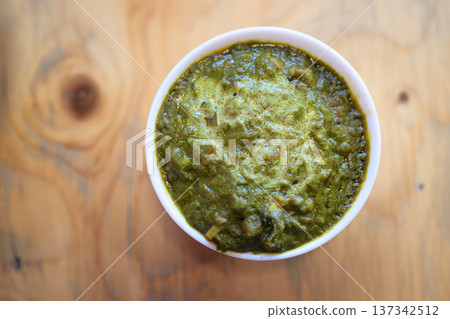 Top View of Indian Palak Paneer Curry on Wooden Table Top View of Indian Palak Paneer Curry on Wooden Table 137342512