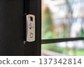 Modern Doorbell Button with Blue Indicator Light 137342814