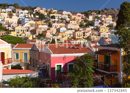 Colorful houses on hillside in Symi island Greece Colorful houses on hillside in Symi island Greece 137342845