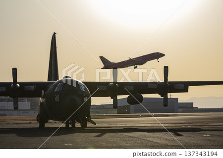 Transport aircraft dyed in the sunset Transport aircraft dyed in the sunset 137343194