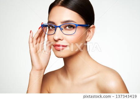 Young woman with eyeglasses on white background 137343419