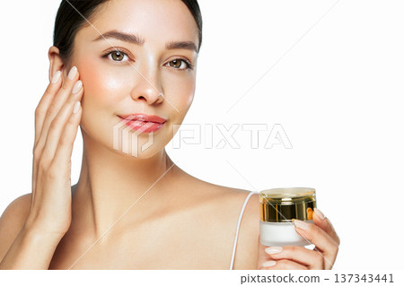 Beauty woman applying cream on her face 137343441