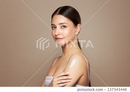 Woman with cream on shoulder 137343446