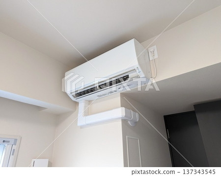 New air conditioner indoor unit installed in an apartment building New air conditioner indoor unit installed in an apartment building 137343545