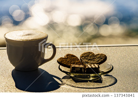 Coffee cup on sea shore. Travel outdoor picnic. Coffee cup on sea shore. Travel outdoor picnic. 137343841