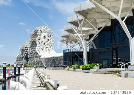 Close-up of Kaohsiung Music Center and the Coral Zone building in Port of Kaohsiung, Taiwan. The white hexagonal building structure on the shore of Love Pier. Close-up of Kaohsiung Music Center and the Coral Zone building in Port of Kaohsiung, Taiwan. The white hexagonal building structure on the shore of Love Pier. 137343929